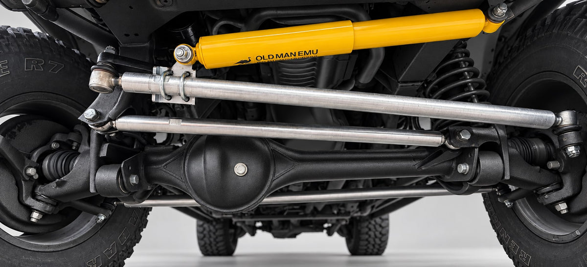 DOR steering and panhard bars fitted to a Discovery 2 with an Old Man Emu steering damper; refurbished appearance digitally visualised.
